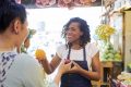 Vendor helping customer at local market